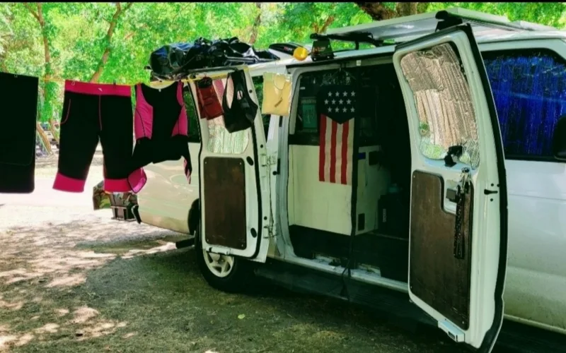 Dry Faster, Smell Less: Better Hanging for Damp or Sweaty Gear | Heavy Duty Hangers by Tough Hook Damp running clothes hanging on a line beside a van to air dry in the shade at camp